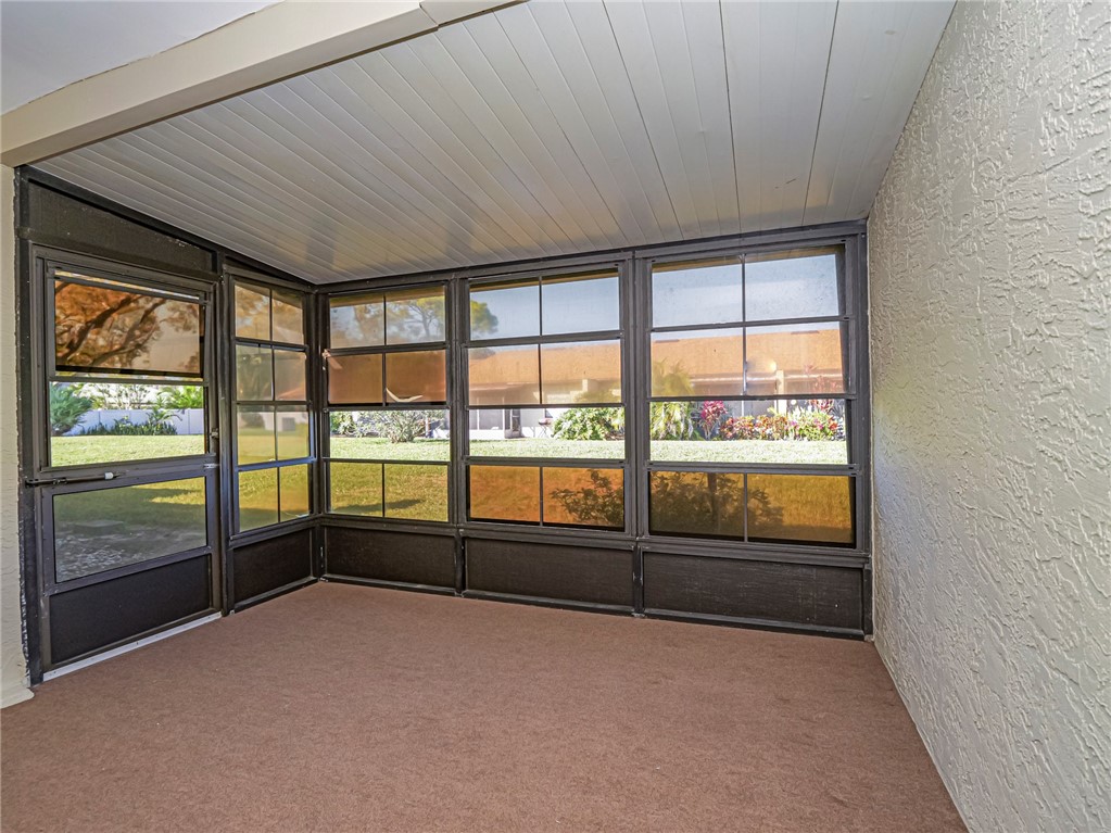 6006 Indrio Road, Unit B4 Fort Pierce, FL 34951 - Photo 27 of 36 a view of an empty room and window