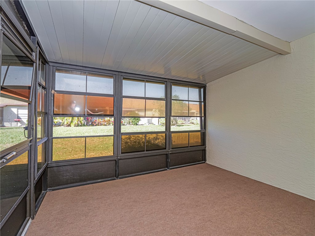 6006 Indrio Road, Unit B4 Fort Pierce, FL 34951 - Photo 28 of 36 a view of an empty room with a window