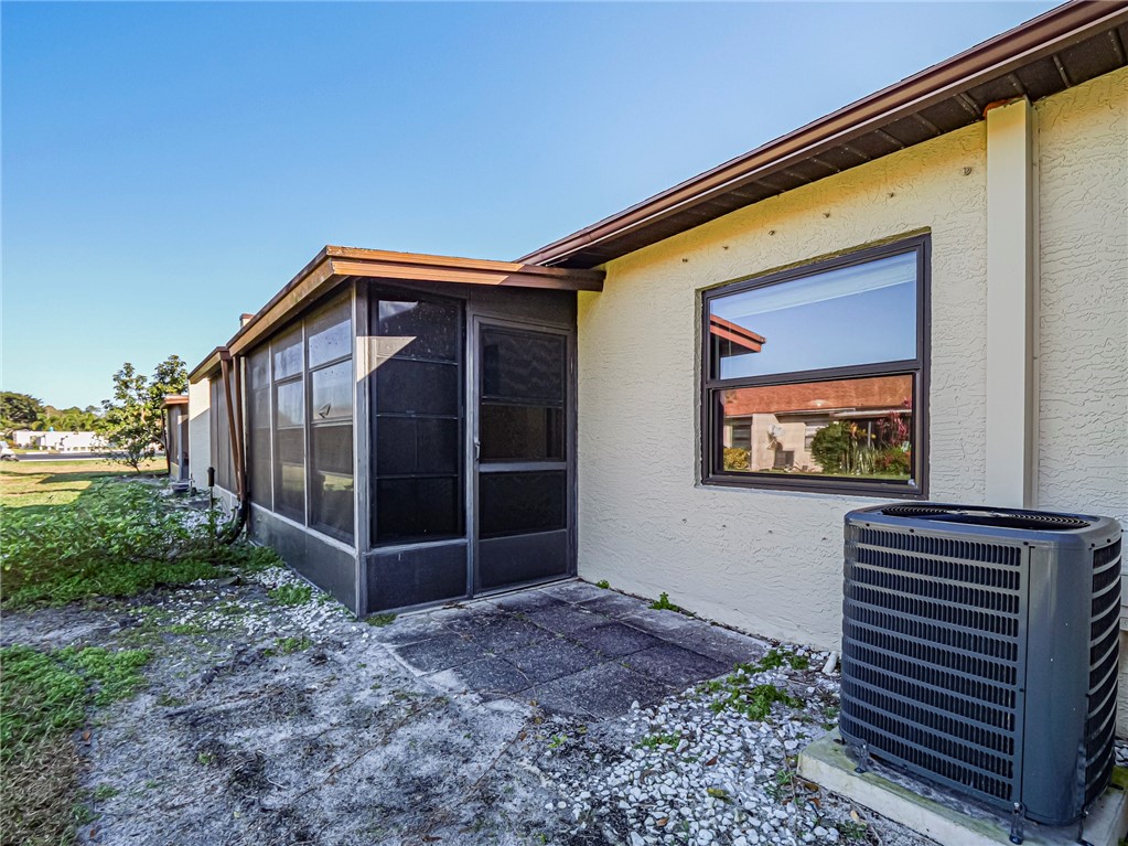 6006 Indrio Road, Unit B4 Fort Pierce, FL 34951 - Photo 29 of 36 a front view of a house with a yard