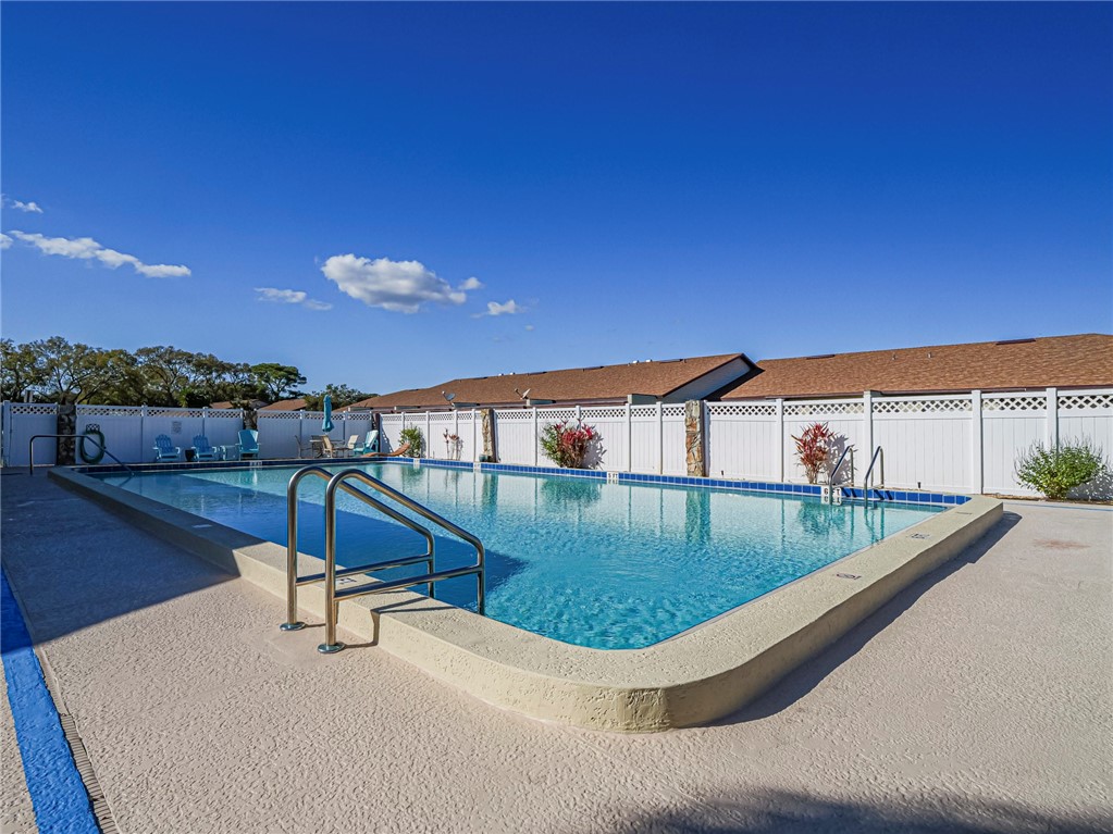 6006 Indrio Road, Unit B4 Fort Pierce, FL 34951 - Photo 34 of 36 a view of swimming pool