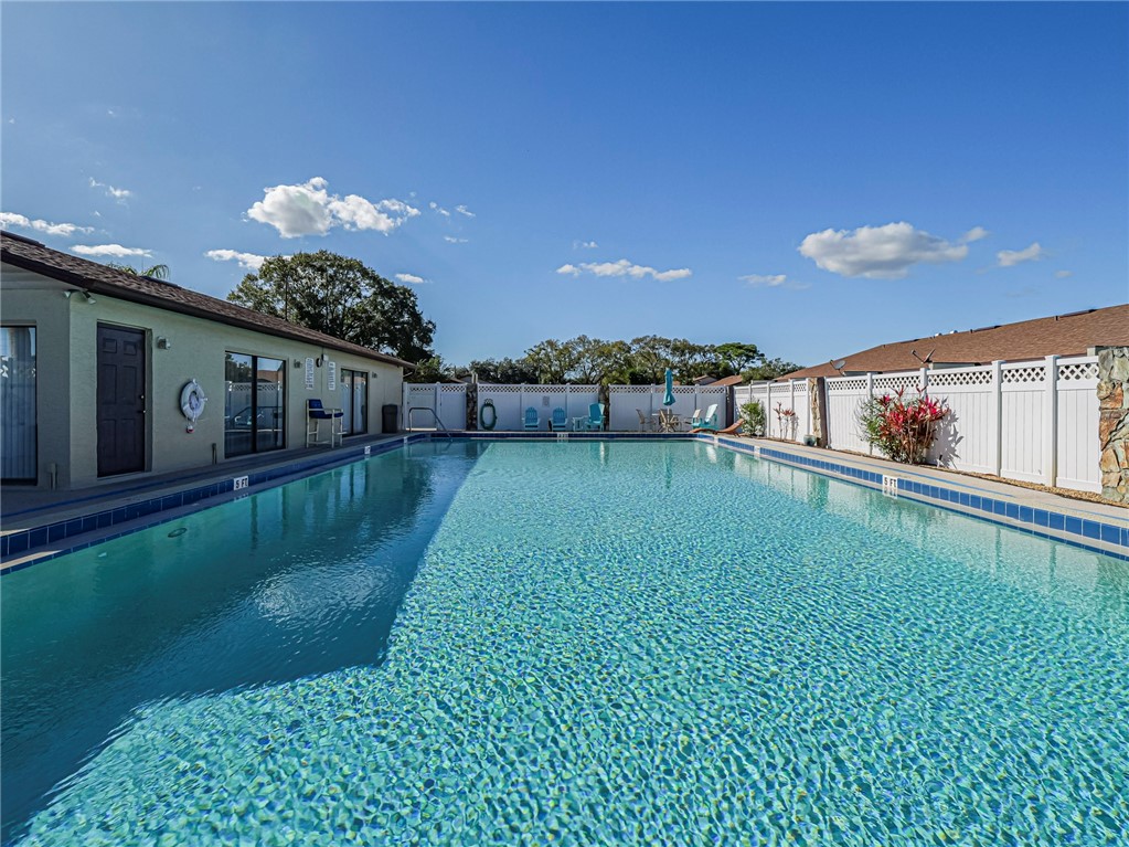 6006 Indrio Road, Unit B4 Fort Pierce, FL 34951 - Photo 35 of 36 a view of a house with a back yard