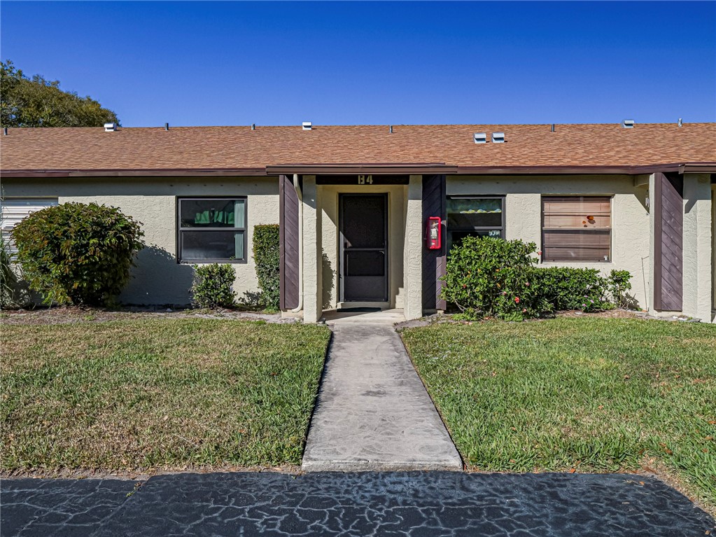 6006 Indrio Road, Unit B4 Fort Pierce, FL 34951 - Photo 4 of 36 front view of a house