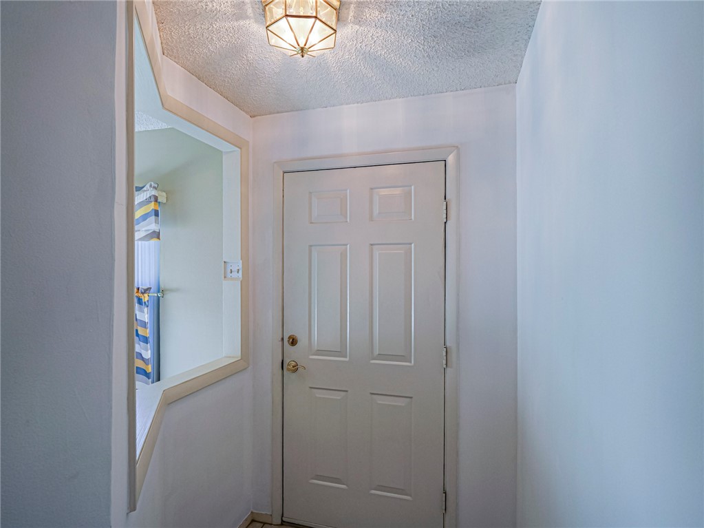 6006 Indrio Road, Unit B4 Fort Pierce, FL 34951 - Photo 5 of 36 a view of a hallway