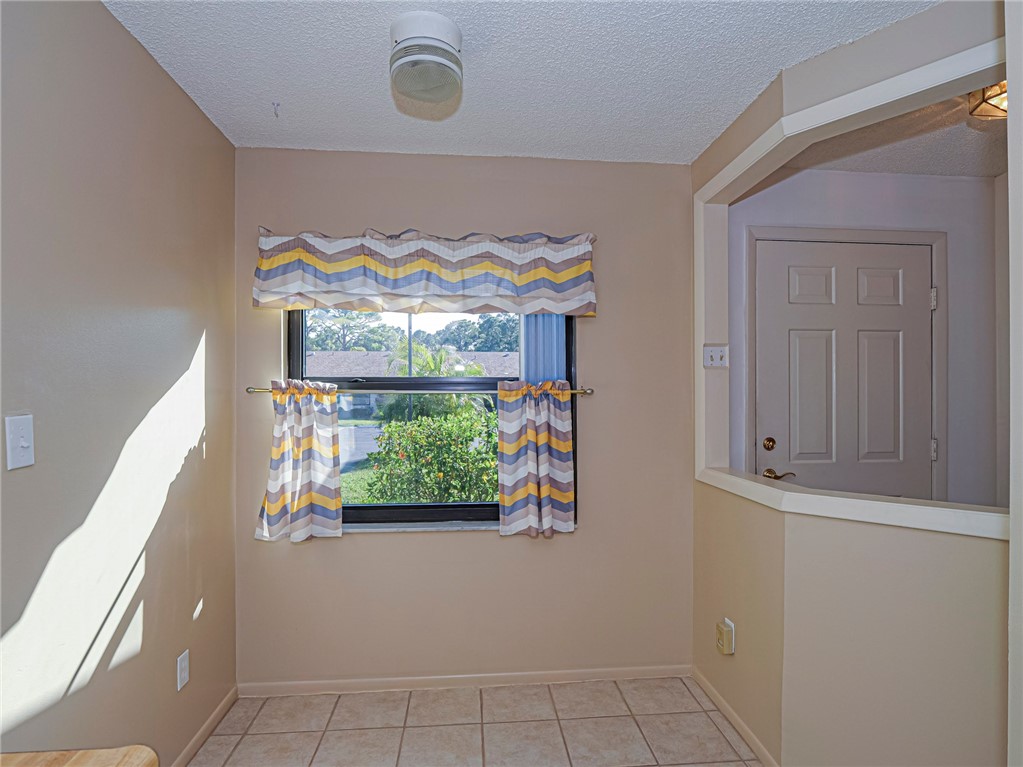 6006 Indrio Road, Unit B4 Fort Pierce, FL 34951 - Photo 9 of 36 front view of a house with an outdoor space