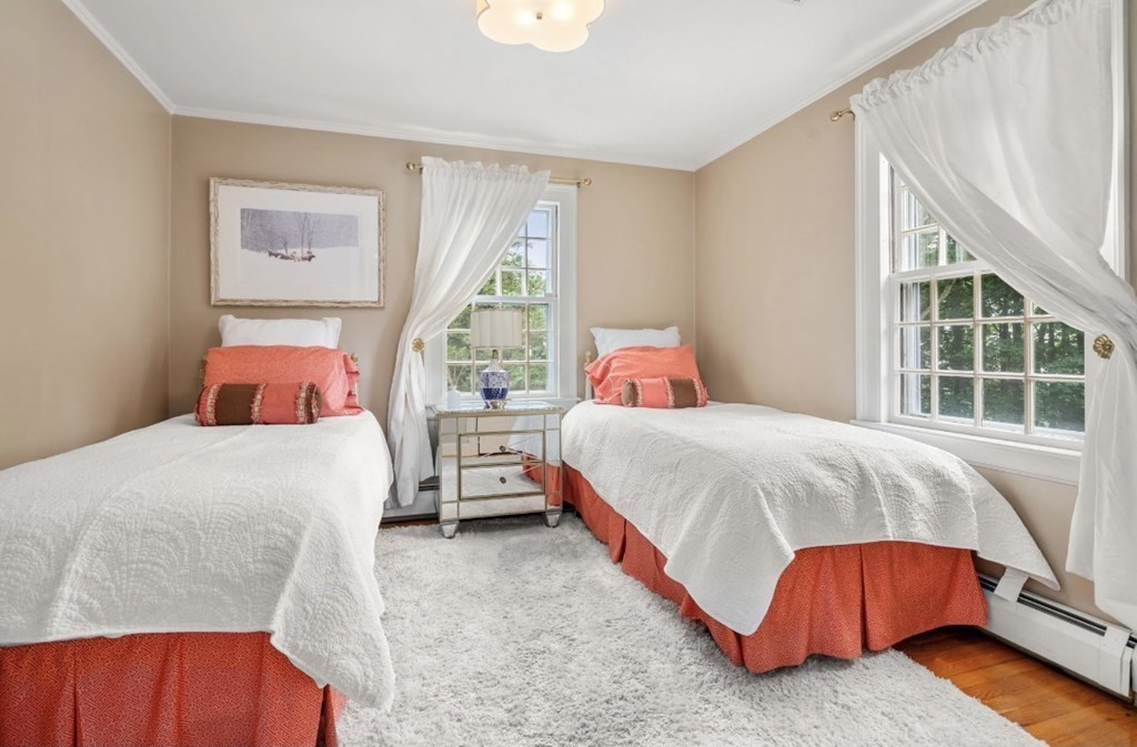 217 Conant Road Weston, MA 02493 - Photo 22 of 30 a bedroom with a bed and a window with outer view