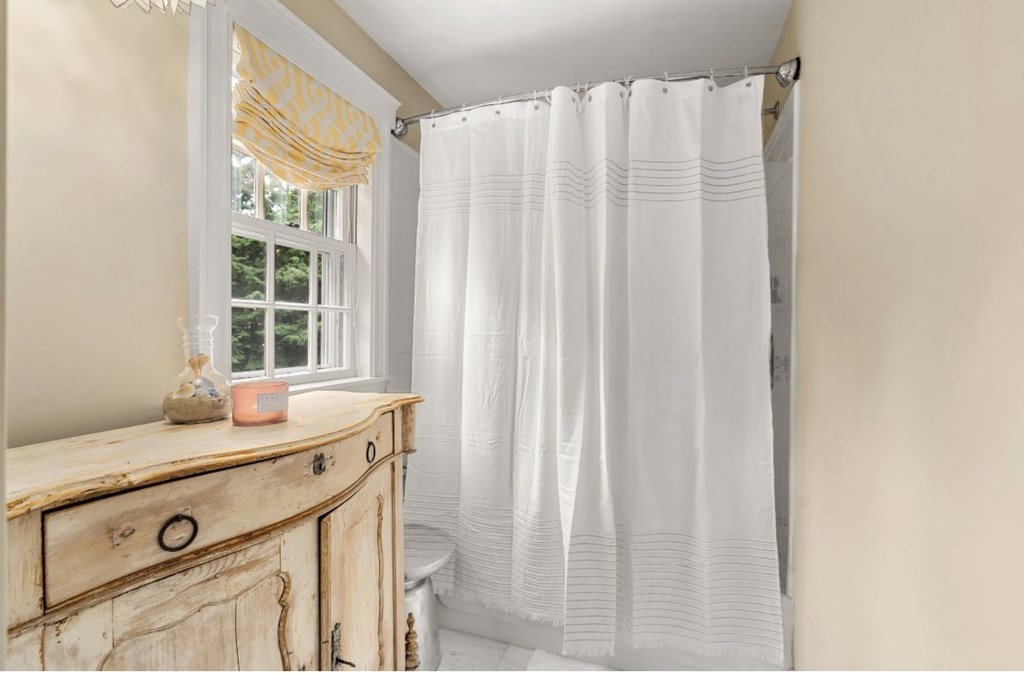 217 Conant Road Weston, MA 02493 - Photo 24 of 30 a bathroom with a sink and a mirror