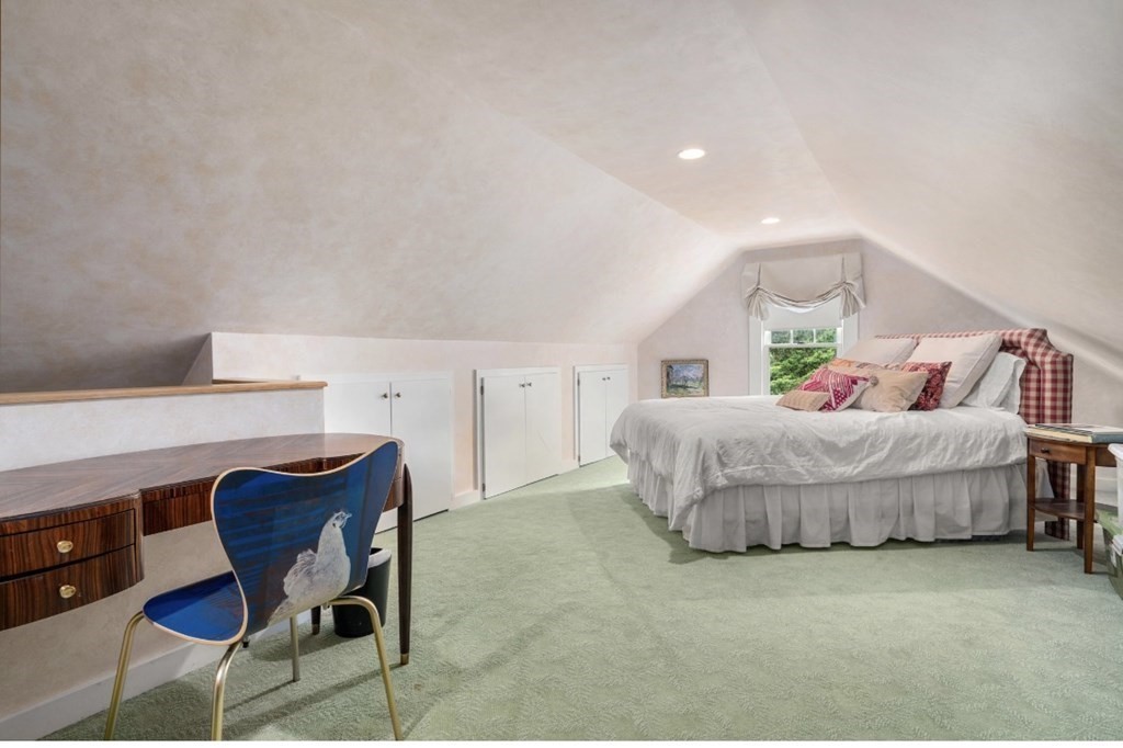 217 Conant Road Weston, MA 02493 - Photo 25 of 30 a bedroom with a bed and chair