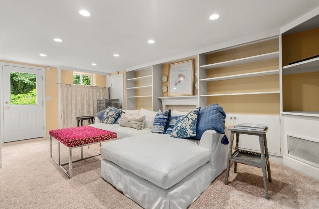 217 Conant Road Weston, MA 02493 - Photo 26 of 30 a spacious bedroom with a bed and a couch