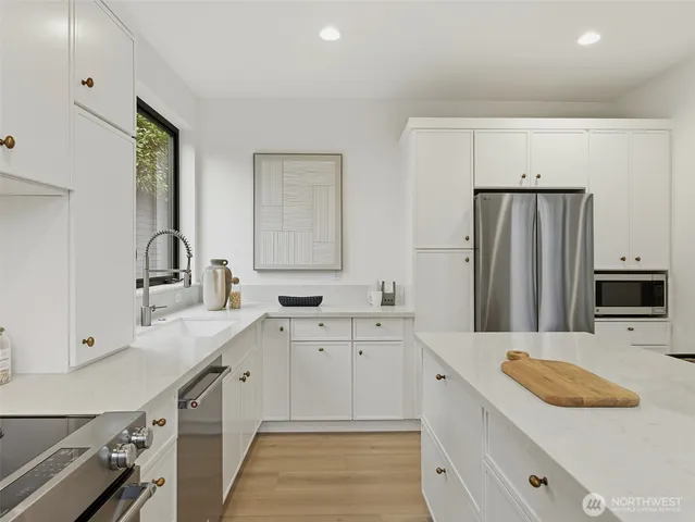 a kitchen with a sink and cabinets