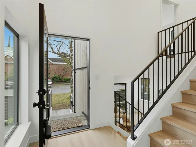 a bathroom with a toilet sink and a mirror