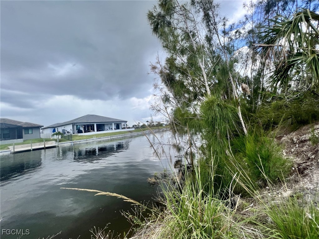 a view of a lake with houses in front of it