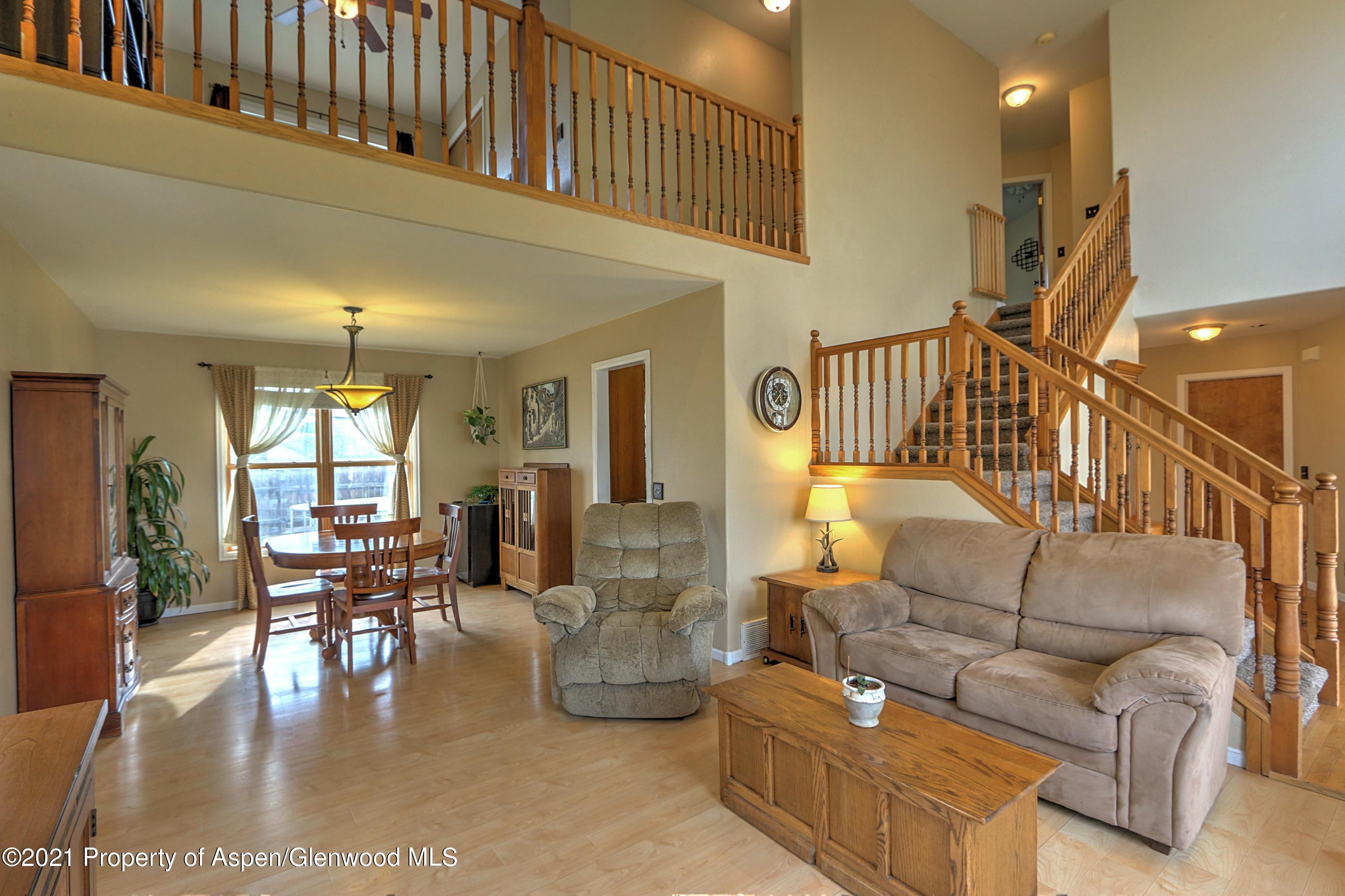 1075 Hickory Drive Rifle, CO 81650 - Photo 5 of 29 a living room with fireplace furniture and a dining table
