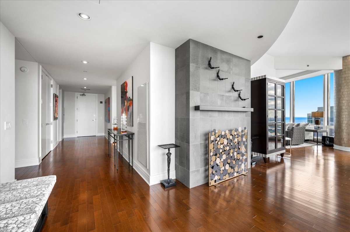 401 North Wabash Avenue, Unit 51E Chicago, IL 60611 - Photo 15 of 57 a view of livingroom with dining room and wooden floor