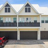 a front view of a house with a garage