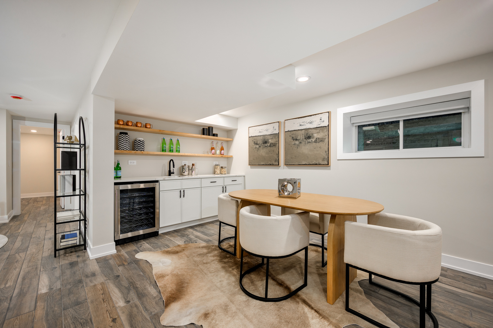 2225 West Carmen Avenue Chicago, IL 60625 - Photo 22 of 45 a kitchen with a dining table chairs refrigerator and cabinets
