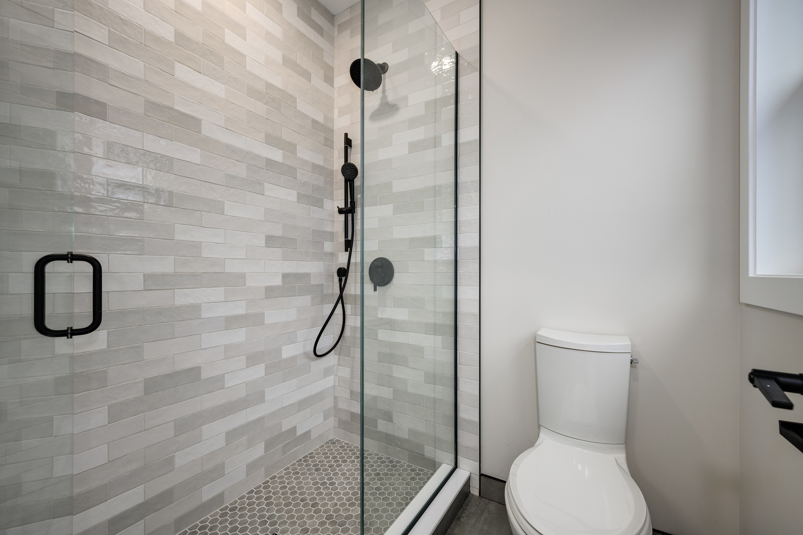 2225 West Carmen Avenue Chicago, IL 60625 - Photo 31 of 45 a bathroom with a shower a toilet and a sink