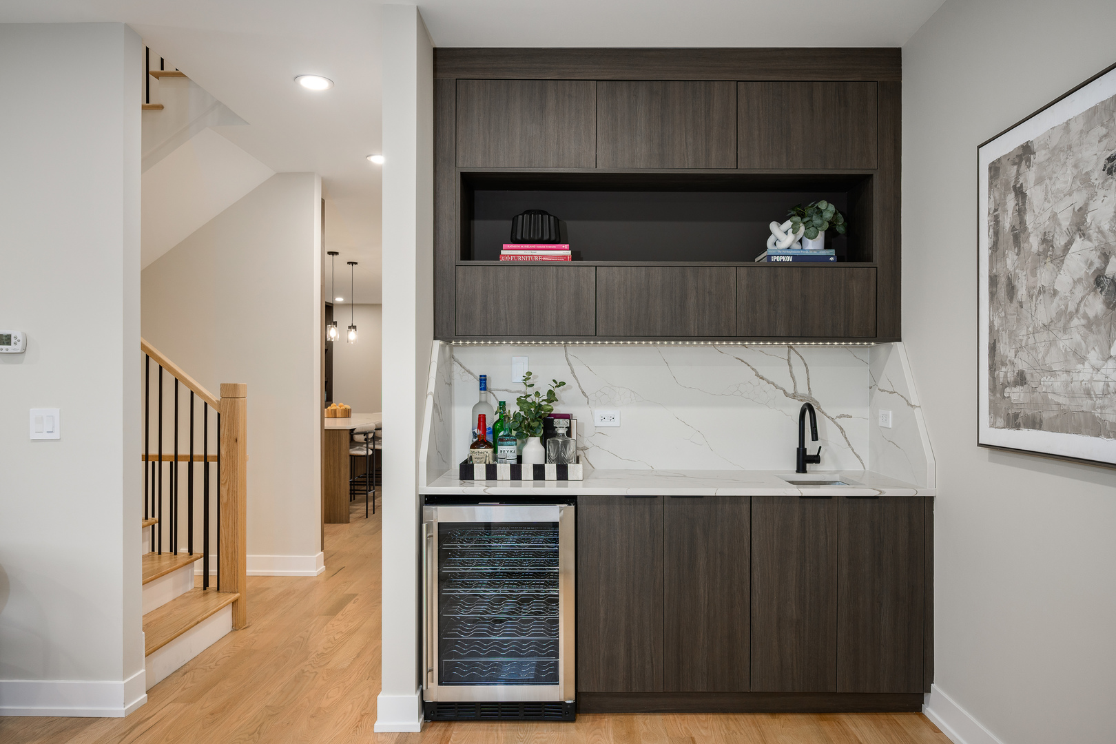 2225 West Carmen Avenue Chicago, IL 60625 - Photo 6 of 45 a kitchen with a wooden floor and a fireplace
