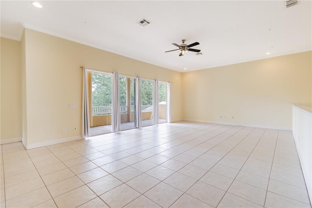 2718 Knightsbridge Road Clermont, FL 34711 - Photo 9 of 72 a view of an empty room with a window