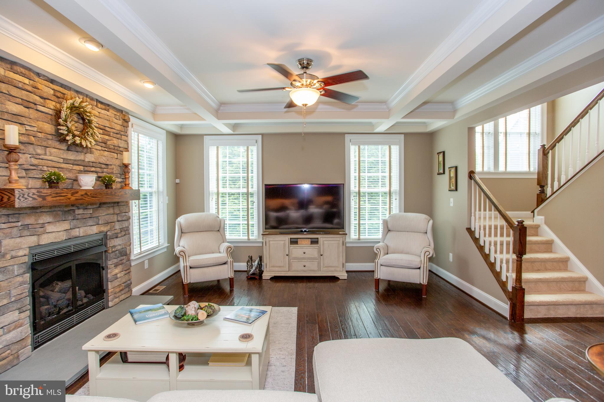 4682 Plough Tavern Road Doylestown, PA 18902 - Photo 10 of 42 a living room with furniture a fireplace and a flat screen tv