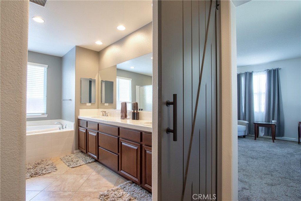 28483 Nautical Point Circle Menifee, CA 92585 - Photo 23 of 44 a view of a bathroom with sink mirror and window