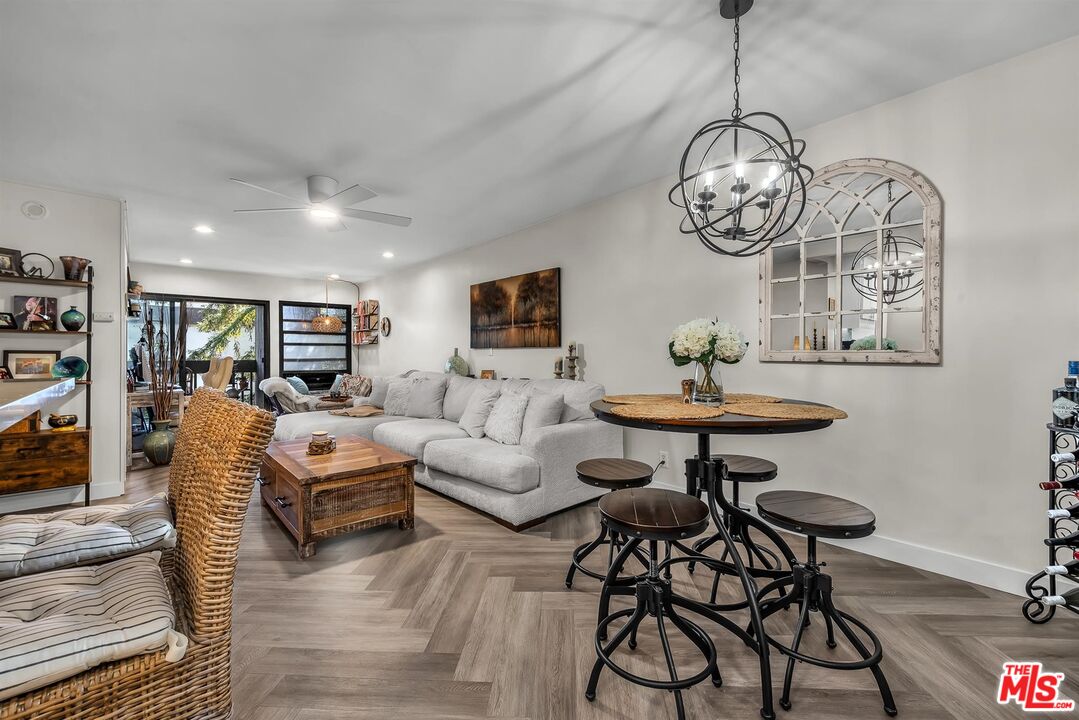7740 Redlands Street, Unit G3092 Playa del Rey, CA 90293 - Photo 3 of 37 a view of a livingroom and dining table chairs