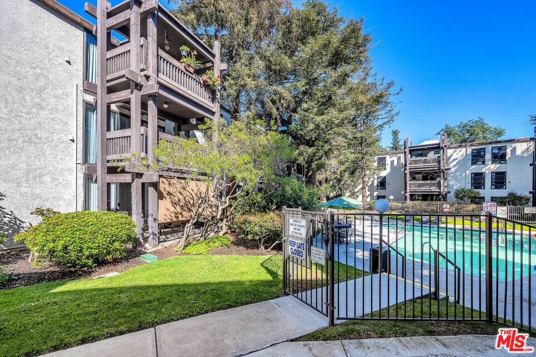 7740 Redlands Street, Unit G3092 Playa del Rey, CA 90293 - Photo 35 of 37 a view of a building with a yard