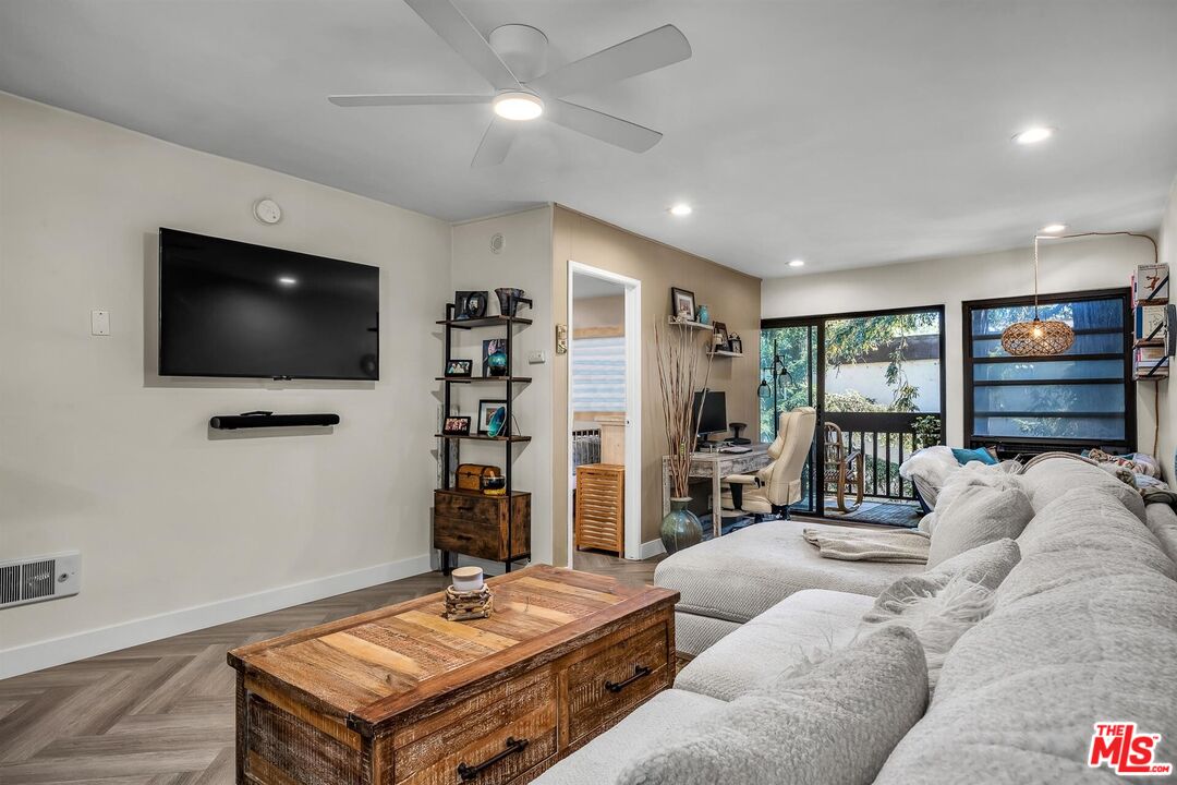 7740 Redlands Street, Unit G3092 Playa del Rey, CA 90293 - Photo 5 of 37 a living room with furniture and a flat screen tv