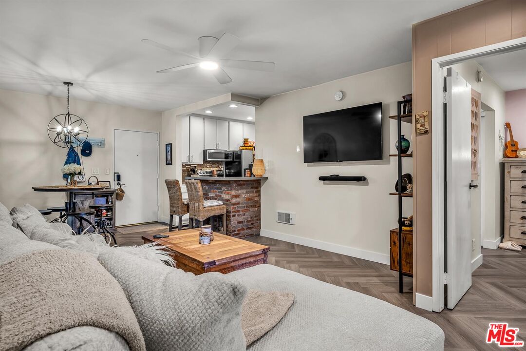7740 Redlands Street, Unit G3092 Playa del Rey, CA 90293 - Photo 6 of 37 a bedroom with furniture and a flat screen tv