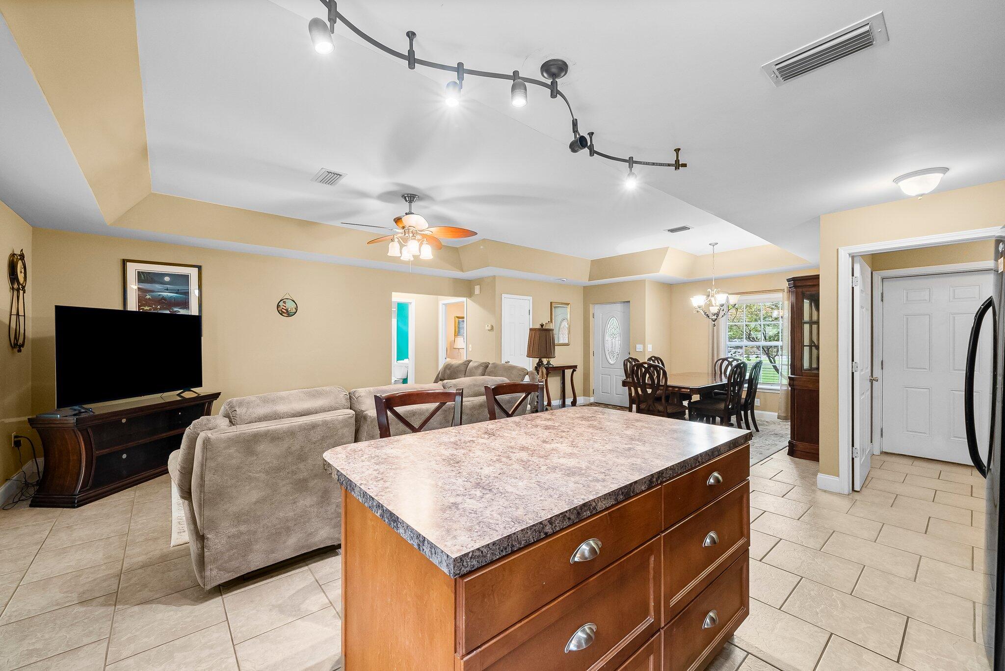 107 Rodney Drive Freeport, FL 32439 - Photo 12 of 34 a living room with furniture and a flat screen tv