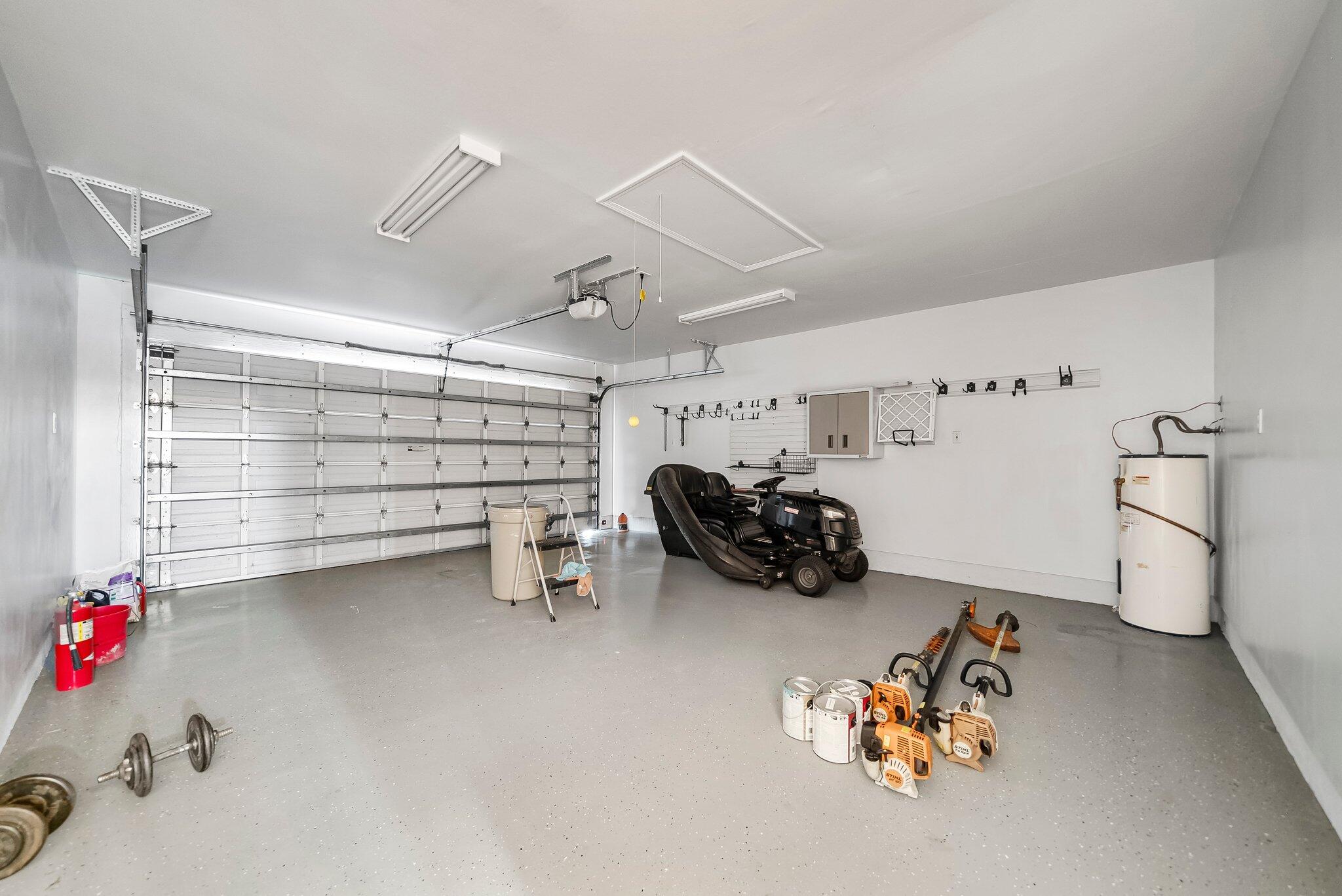 107 Rodney Drive Freeport, FL 32439 - Photo 13 of 34 a bedroom with furniture and a chandelier