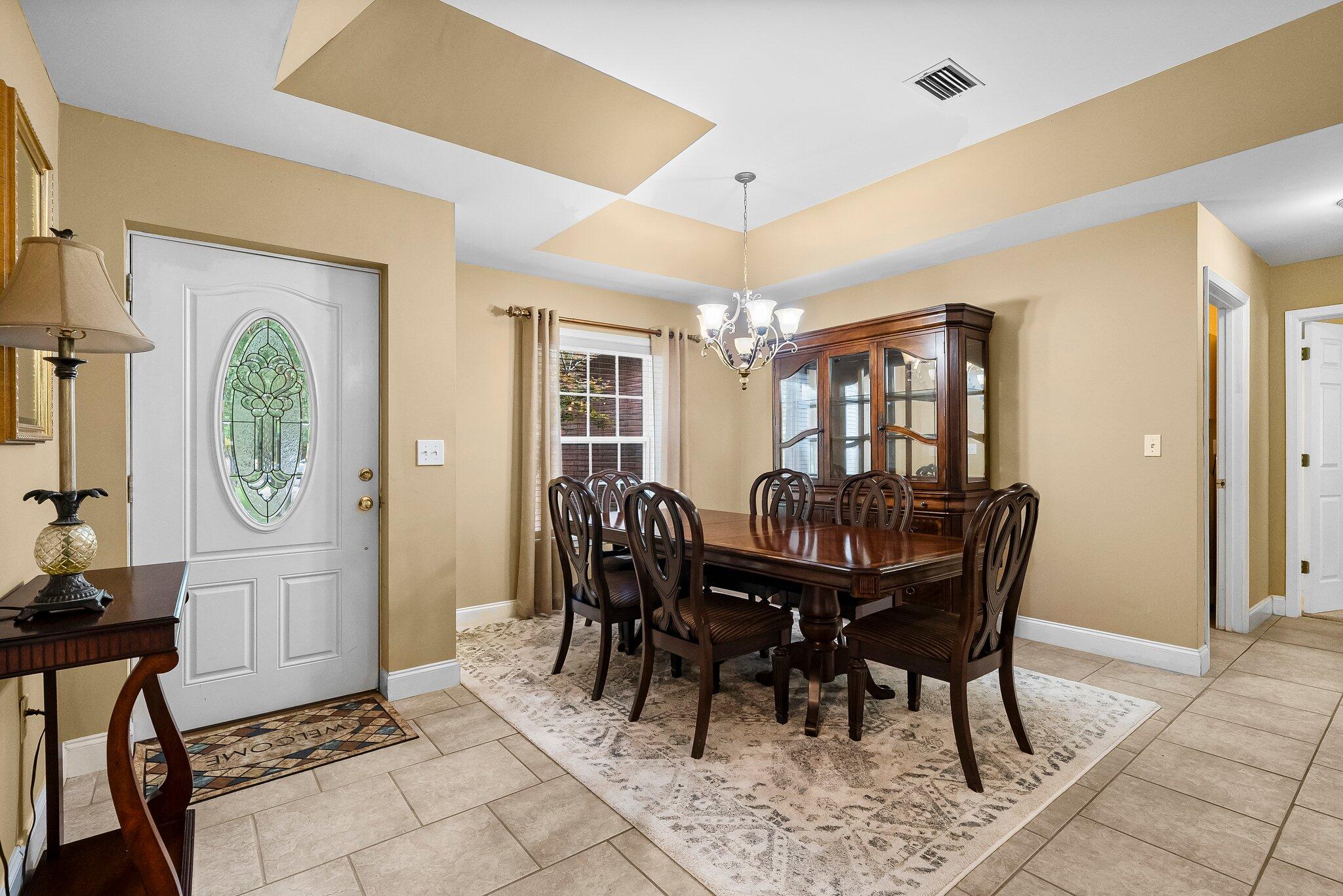 107 Rodney Drive Freeport, FL 32439 - Photo 5 of 34 a view of a dining room with furniture and chandelier
