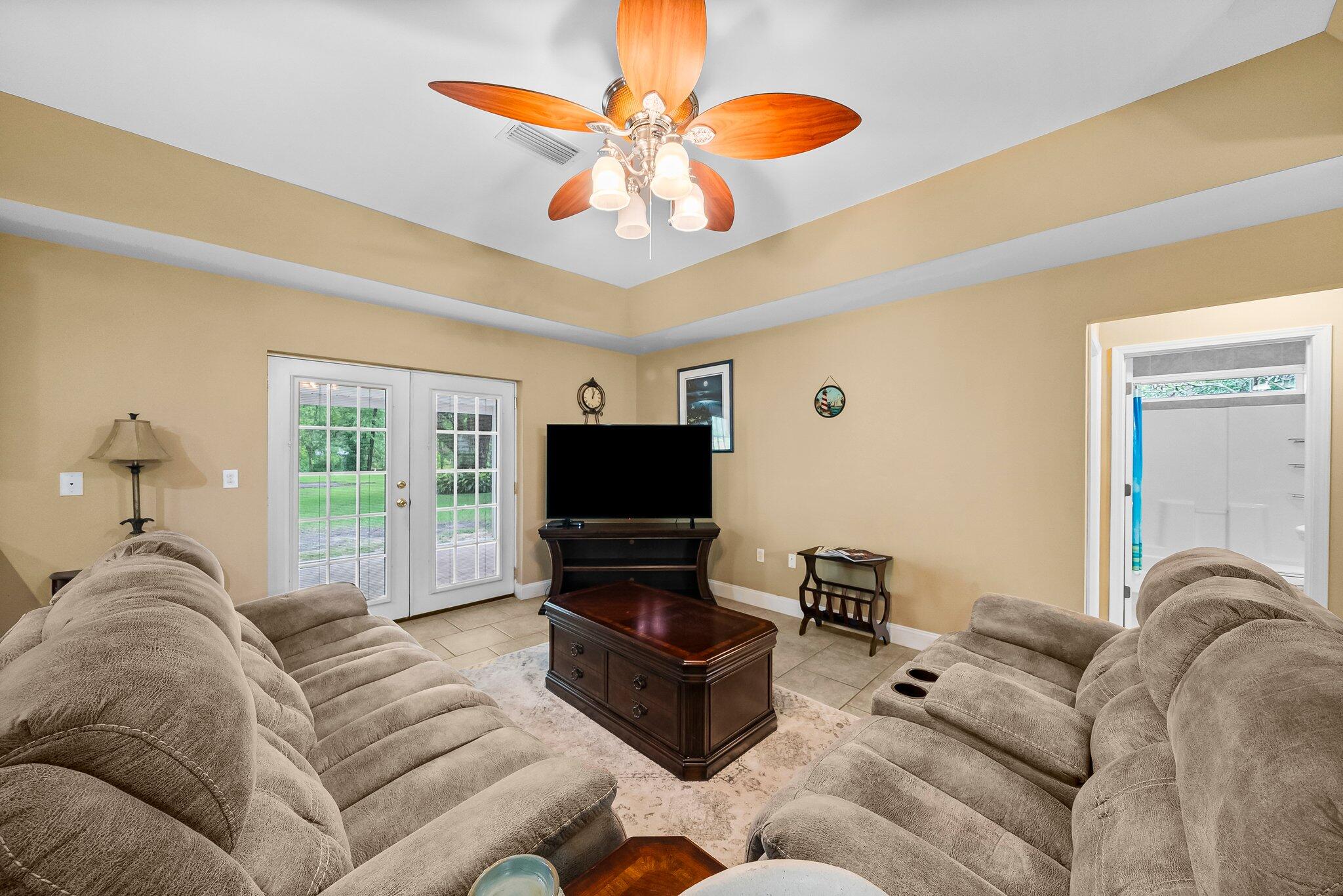 107 Rodney Drive Freeport, FL 32439 - Photo 8 of 34 a living room with furniture and a flat screen tv