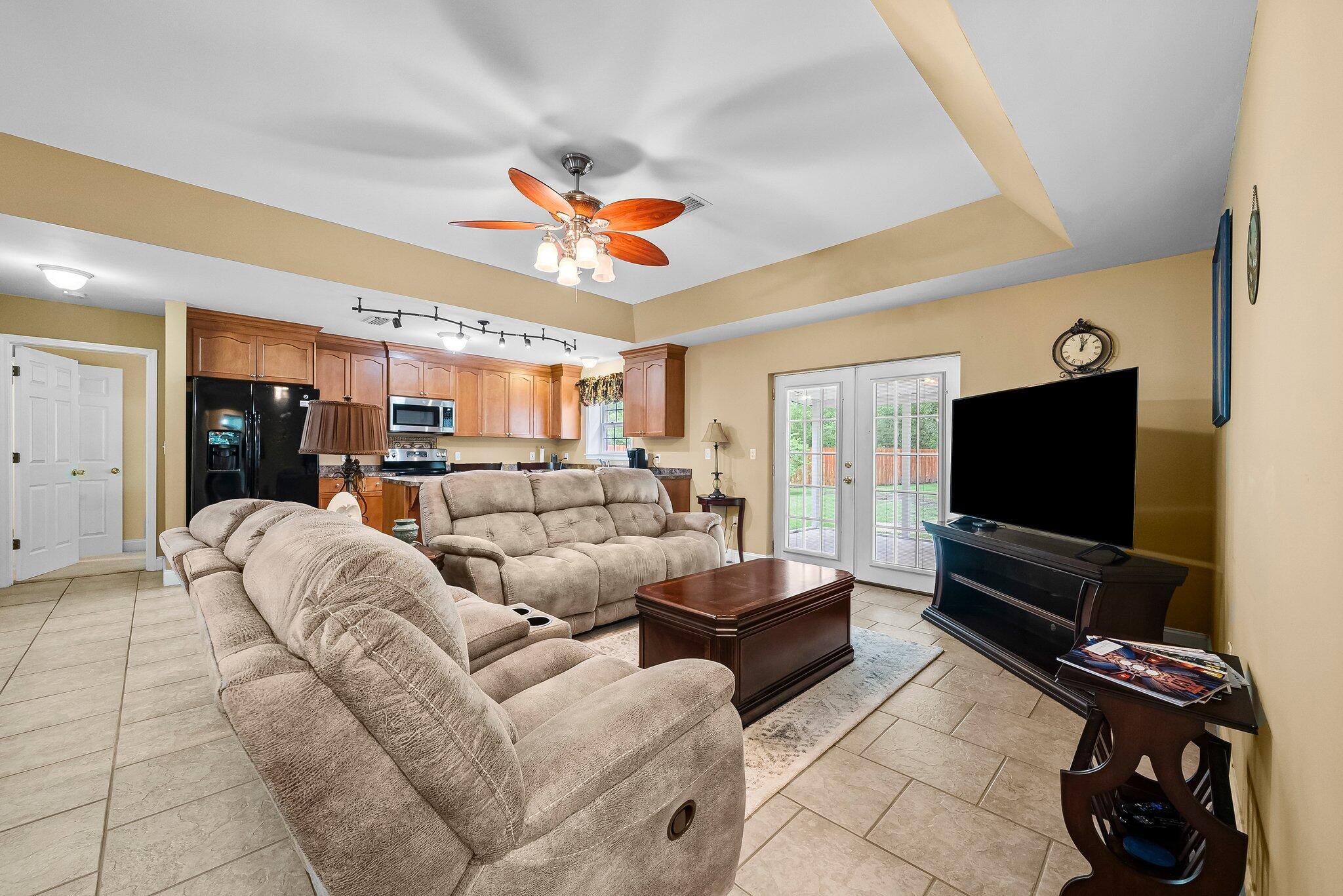 107 Rodney Drive Freeport, FL 32439 - Photo 9 of 34 a living room with furniture and a flat screen tv