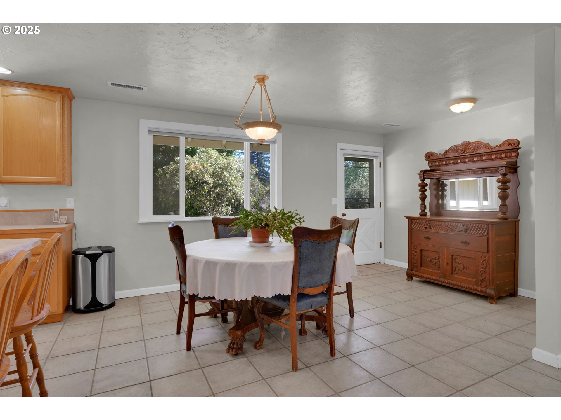 89550 Dick Way Florence, OR 97439 - Photo 11 of 39 a dining room with furniture a chandelier and window