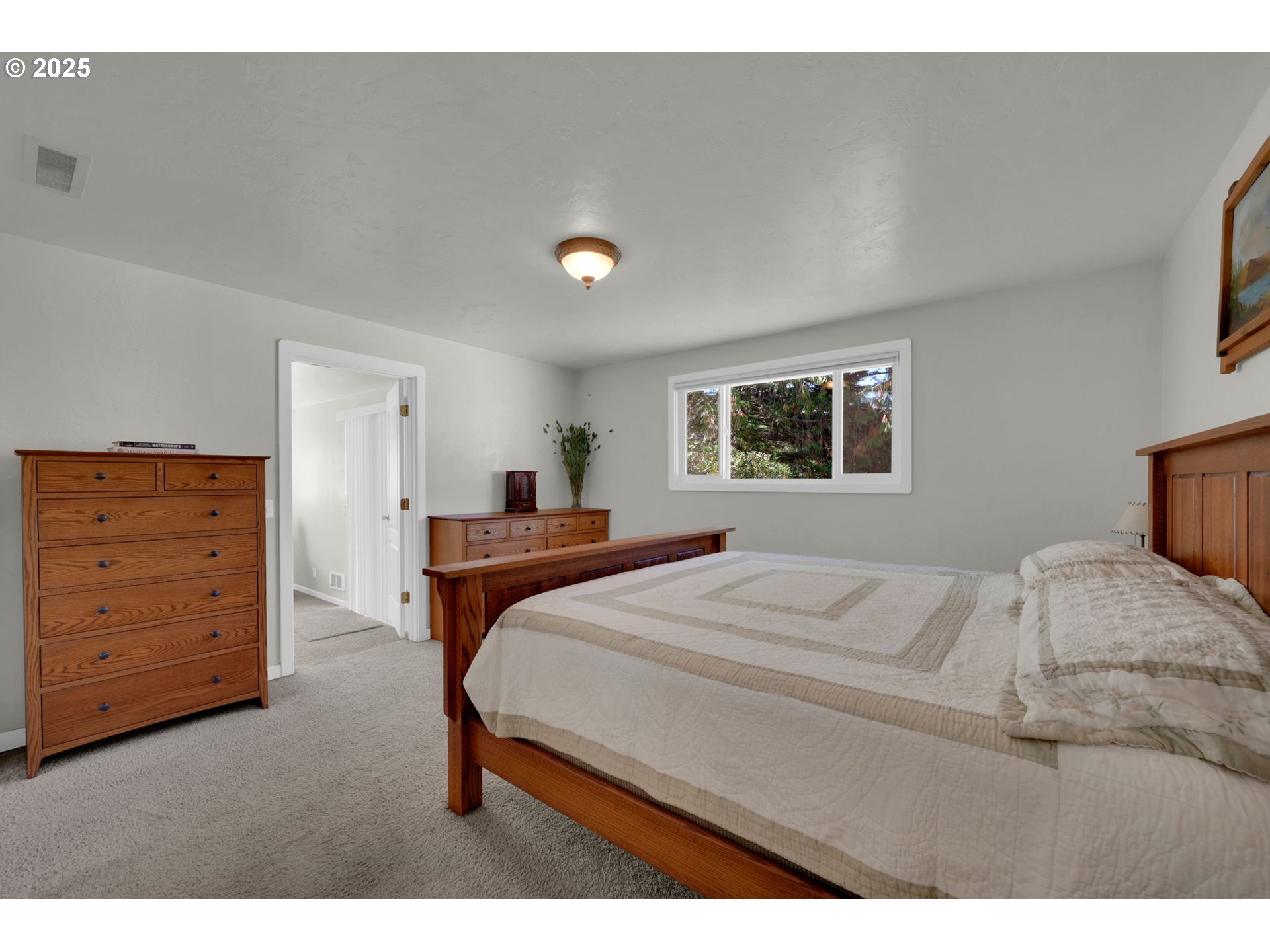 89550 Dick Way Florence, OR 97439 - Photo 14 of 39 a bedroom with a bed and a dresser