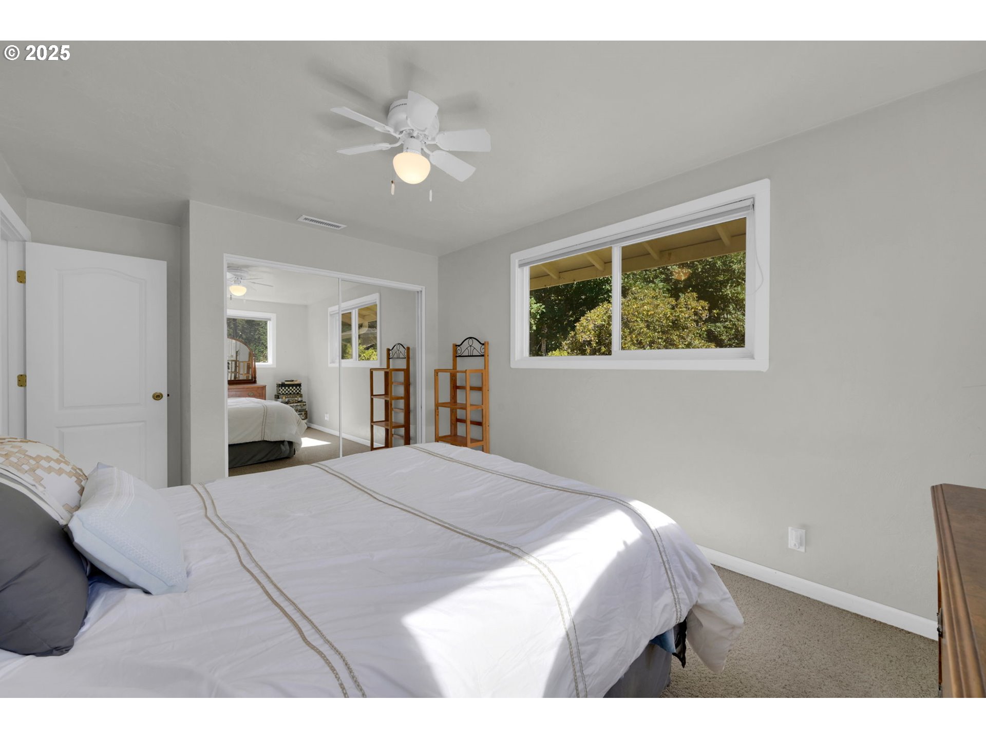 89550 Dick Way Florence, OR 97439 - Photo 17 of 39 a view of a bedroom with wooden floor and window