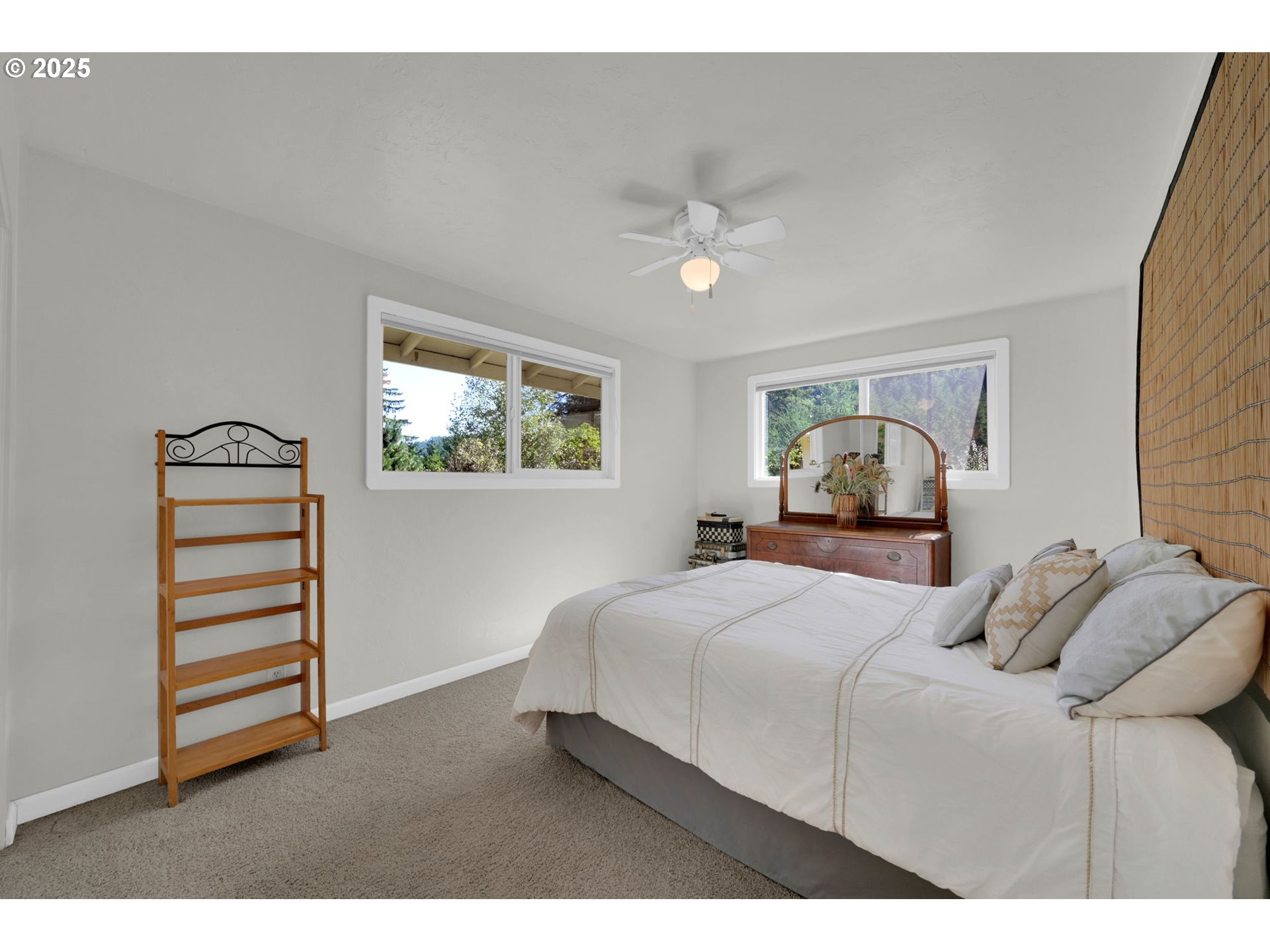 89550 Dick Way Florence, OR 97439 - Photo 18 of 39 a bedroom with a bed and a chandelier