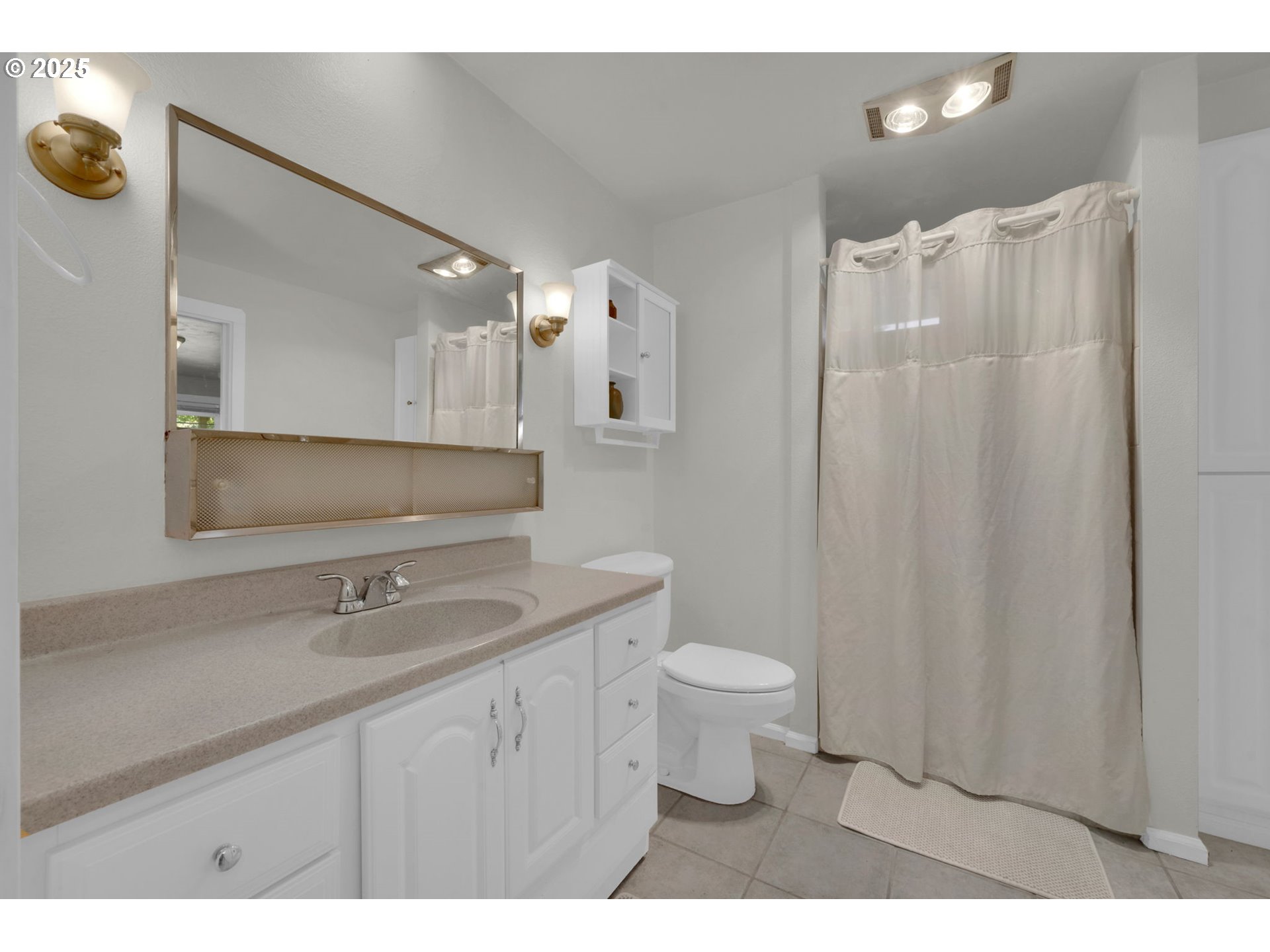 89550 Dick Way Florence, OR 97439 - Photo 21 of 39 a bathroom with a sink toilet a mirror and vanity