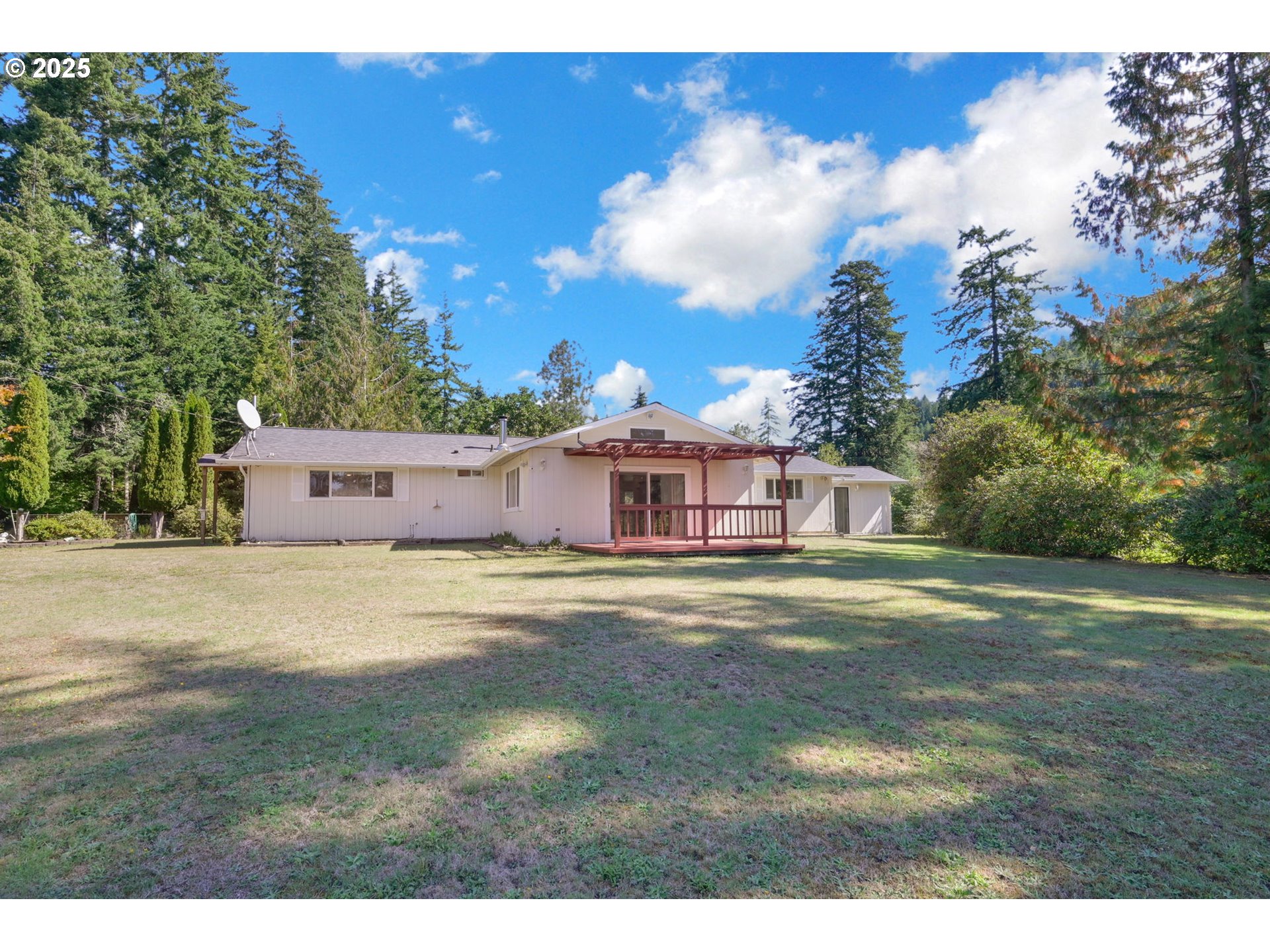 89550 Dick Way Florence, OR 97439 - Photo 26 of 39 a view of a big yard with large trees and a big yard