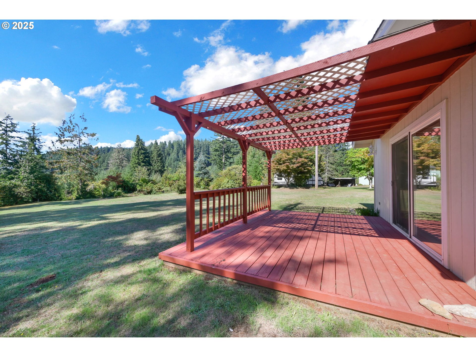 89550 Dick Way Florence, OR 97439 - Photo 28 of 39 a view of a backyard with sitting area