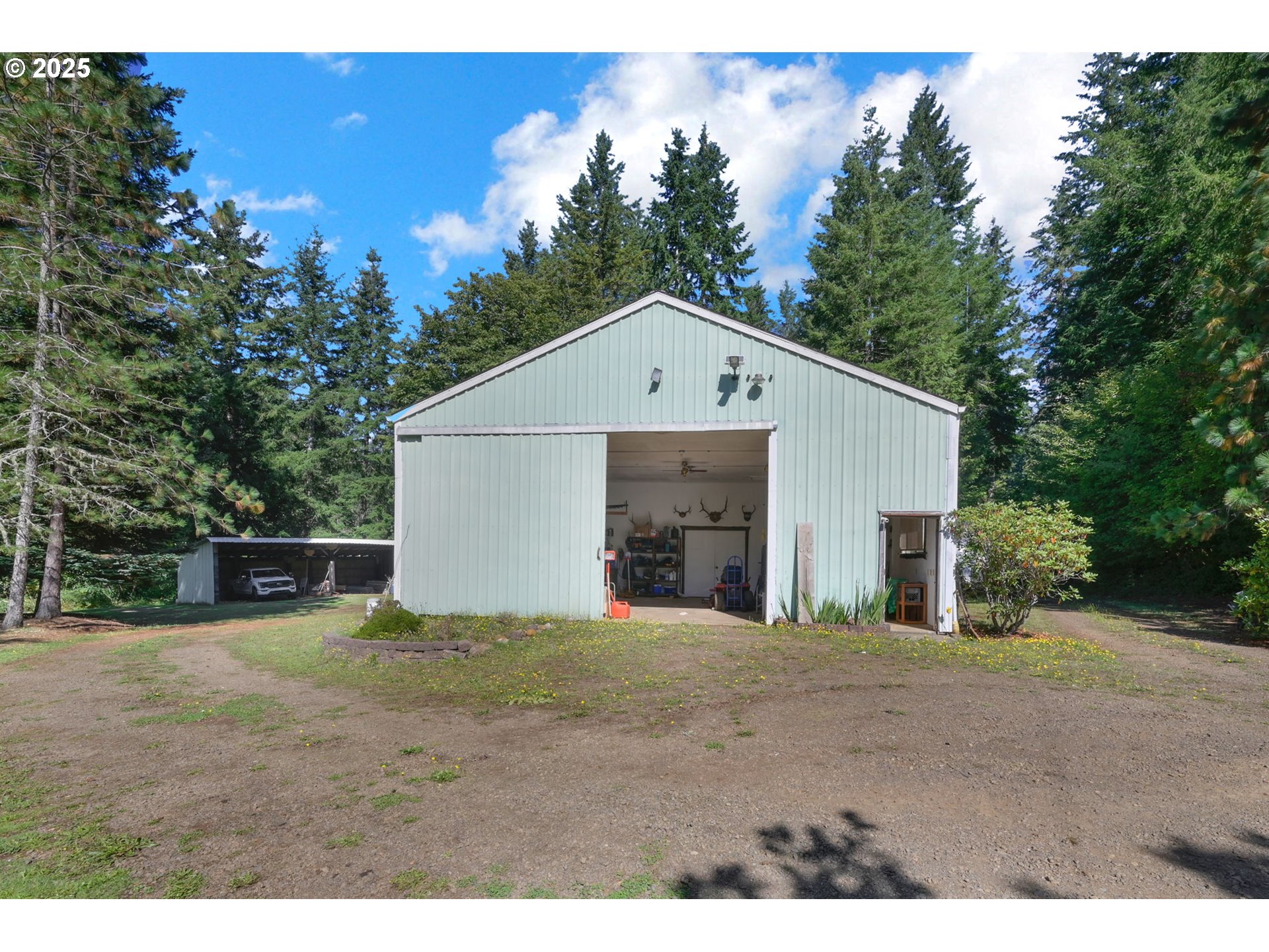 89550 Dick Way Florence, OR 97439 - Photo 30 of 39 a view of a house with a yard