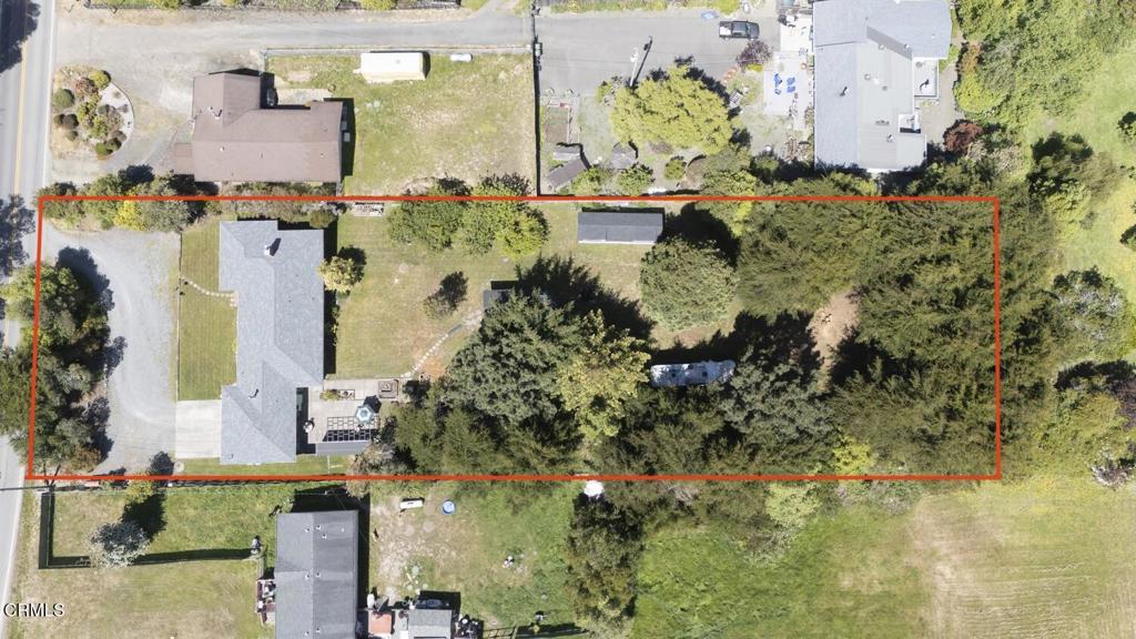 31400 Sherwood Road Fort Bragg, CA 95437 - Photo 53 of 55 an aerial view of a house with a yard and large trees