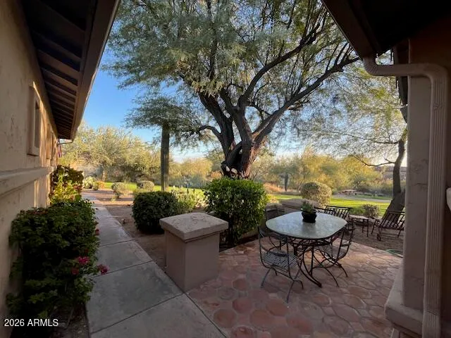 a view of a swimming pool with furniture