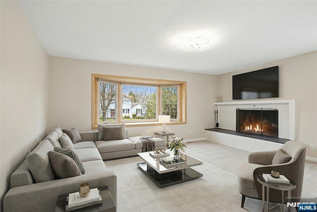 53 Forest Road Demarest, NJ 07627 - Photo 3 of 17 a living room with furniture fireplace and window