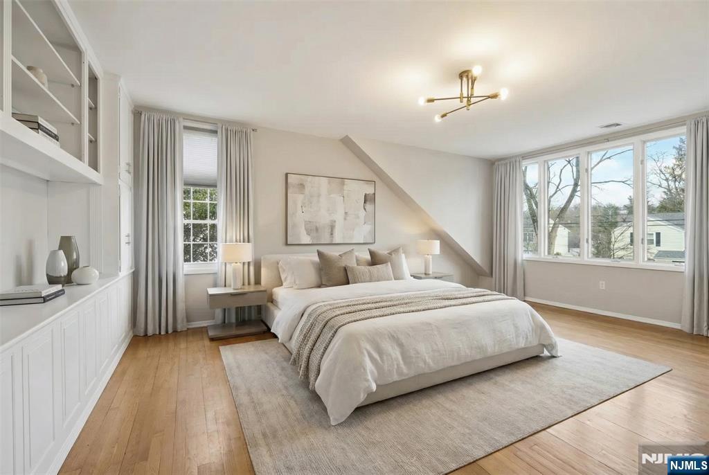 53 Forest Road Demarest, NJ 07627 - Photo 9 of 17 a bedroom with a large bed and a large window