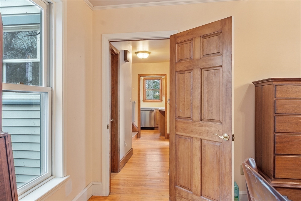 320 Old Ayer Road Groton, MA 01450 - Photo 14 of 42 a view of a hallway with wooden floor and staircase