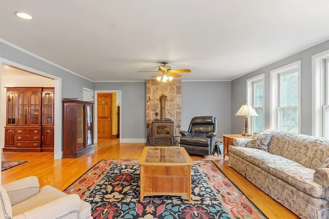 a living room with furniture and a chandelier