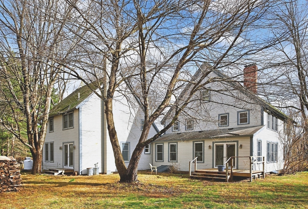 320 Old Ayer Road Groton, MA 01450 - Photo 23 of 42 a front view of a houses with yard and large trees