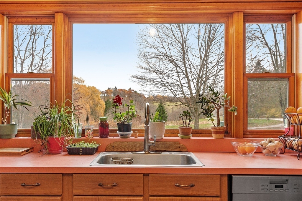 320 Old Ayer Road Groton, MA 01450 - Photo 26 of 42 a view of living room with a large window and potted plants