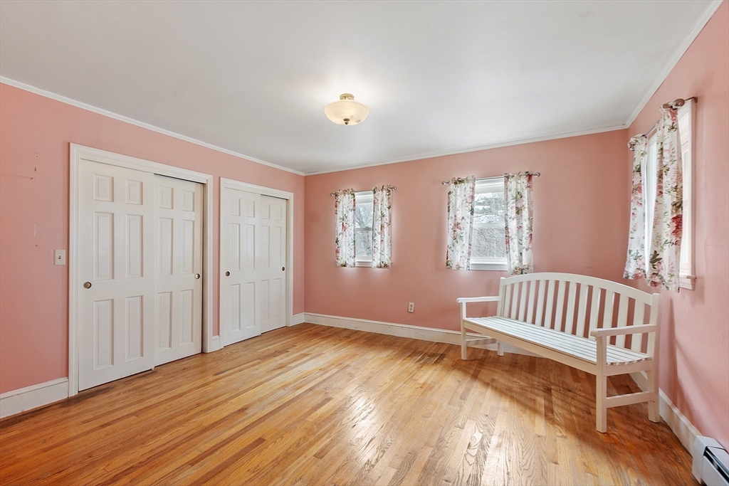 320 Old Ayer Road Groton, MA 01450 - Photo 32 of 42 a view of an empty room with wooden floor and a window